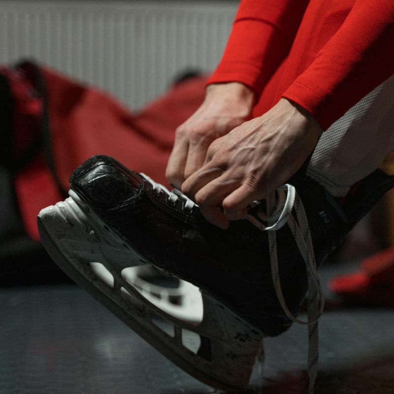 Close up of a person hands tying athletic shoes
