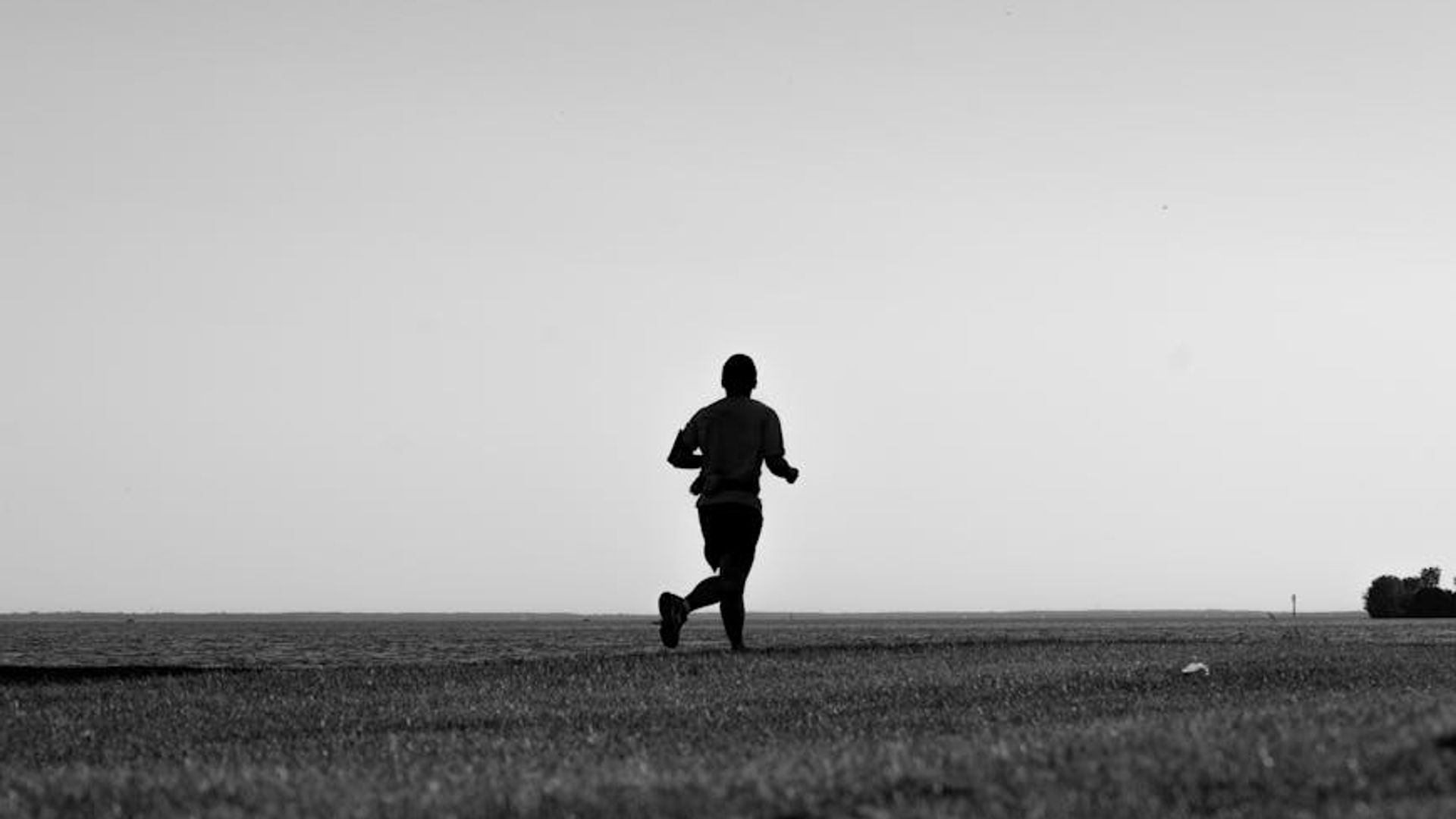 Person running at dawn reflecting active lifestyle concept